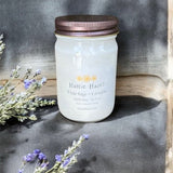 A white sage + lavendar soy candle with rust colored lid from Hattie Hazel.