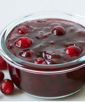 cooked cranberries in clear bowl