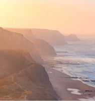 misty picture of coastal bluffs and the coastline