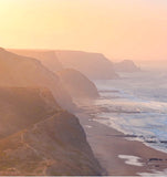 misty picture of coastal bluffs and the coastline