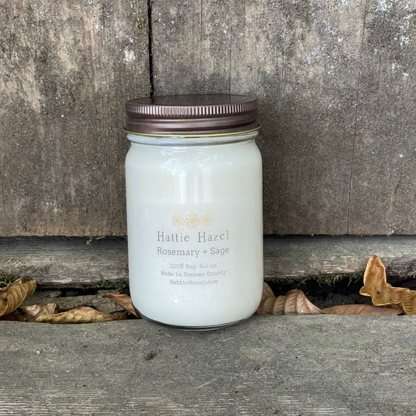 soy candle in a clear jar with a metal lid